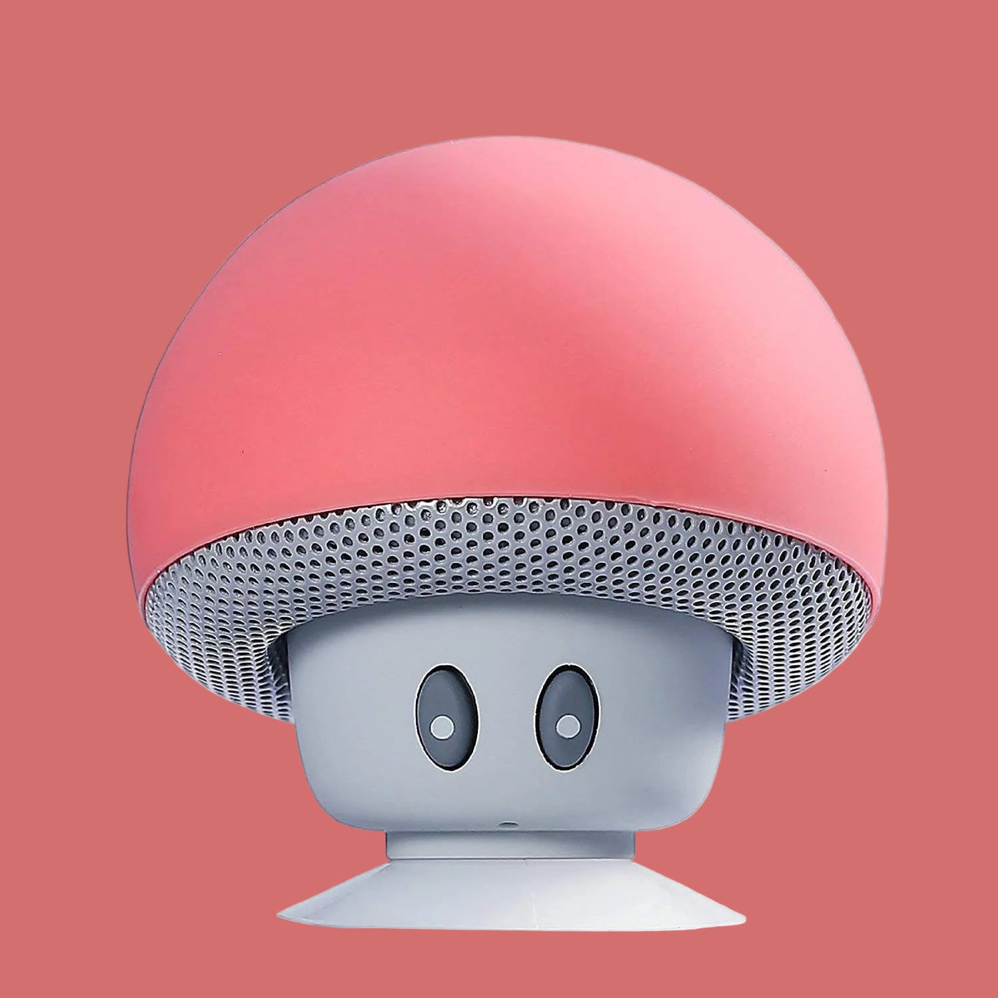 Mushroom-shaped speaker with pink top and gray bottom on a white background