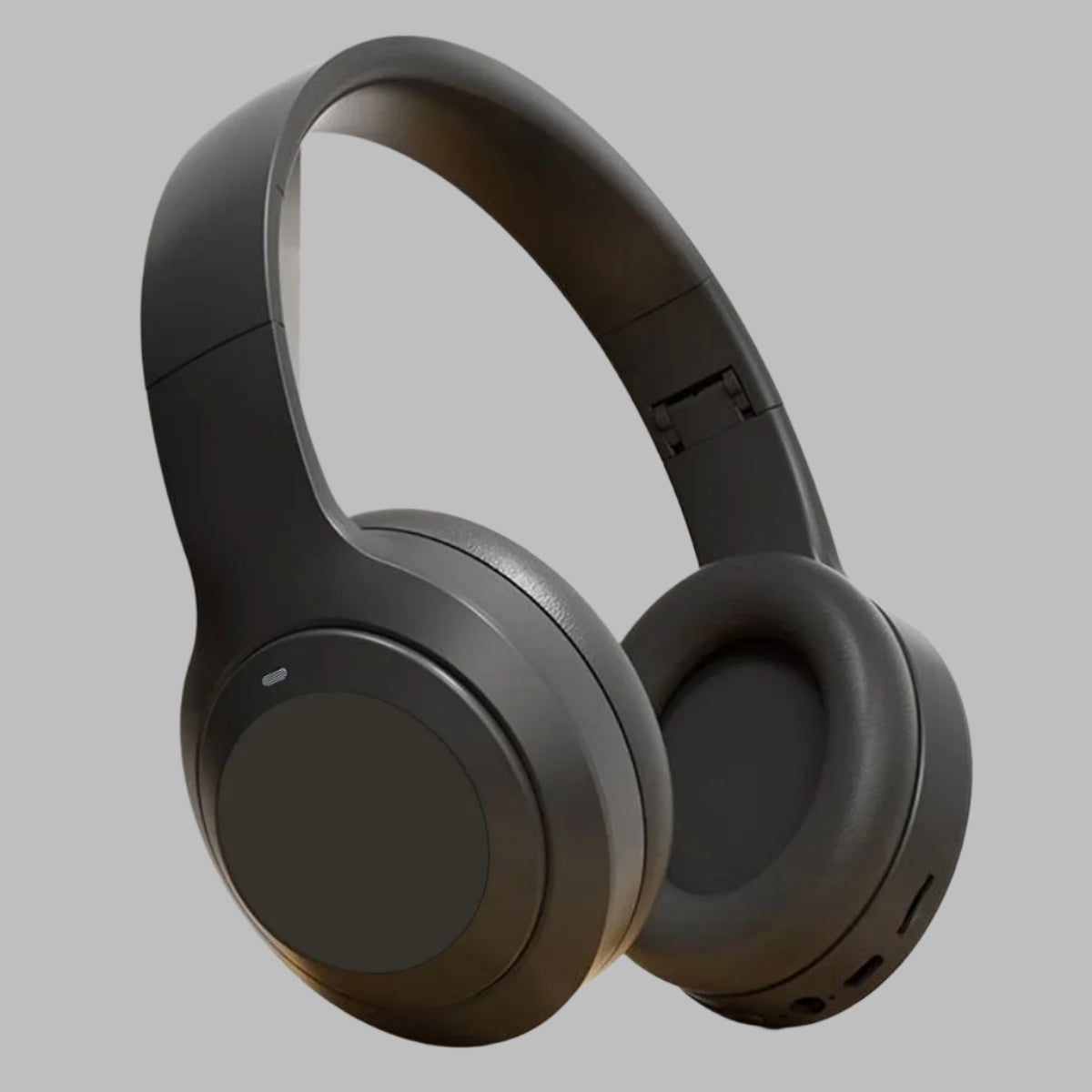 Black over-ear headphones on a light gray background